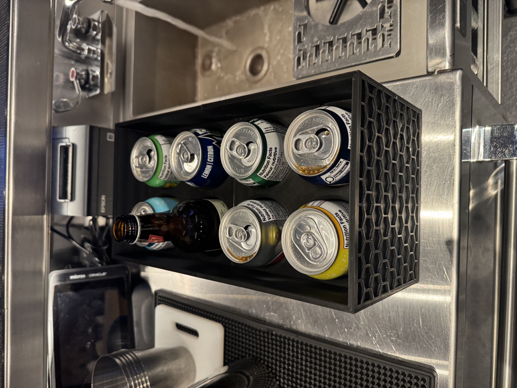 Can holder loaded with cans and a bottle