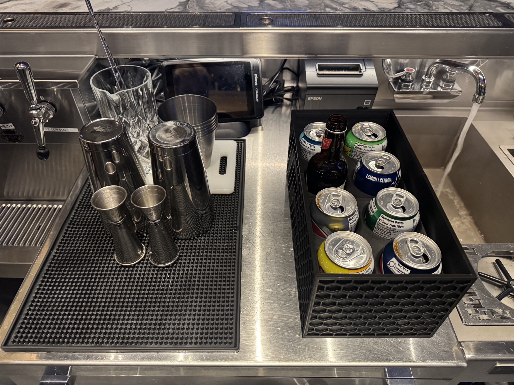 Black honeycomb can holder installed at a bar
