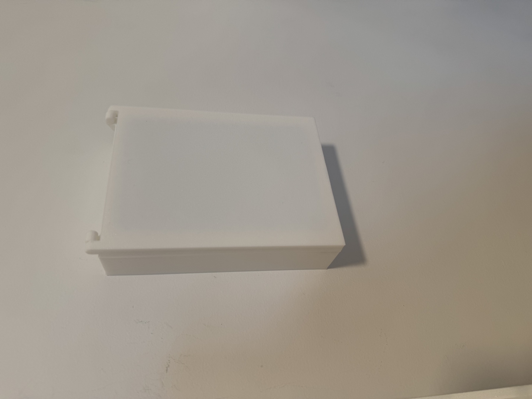 Angled view of the installed thermostat cover