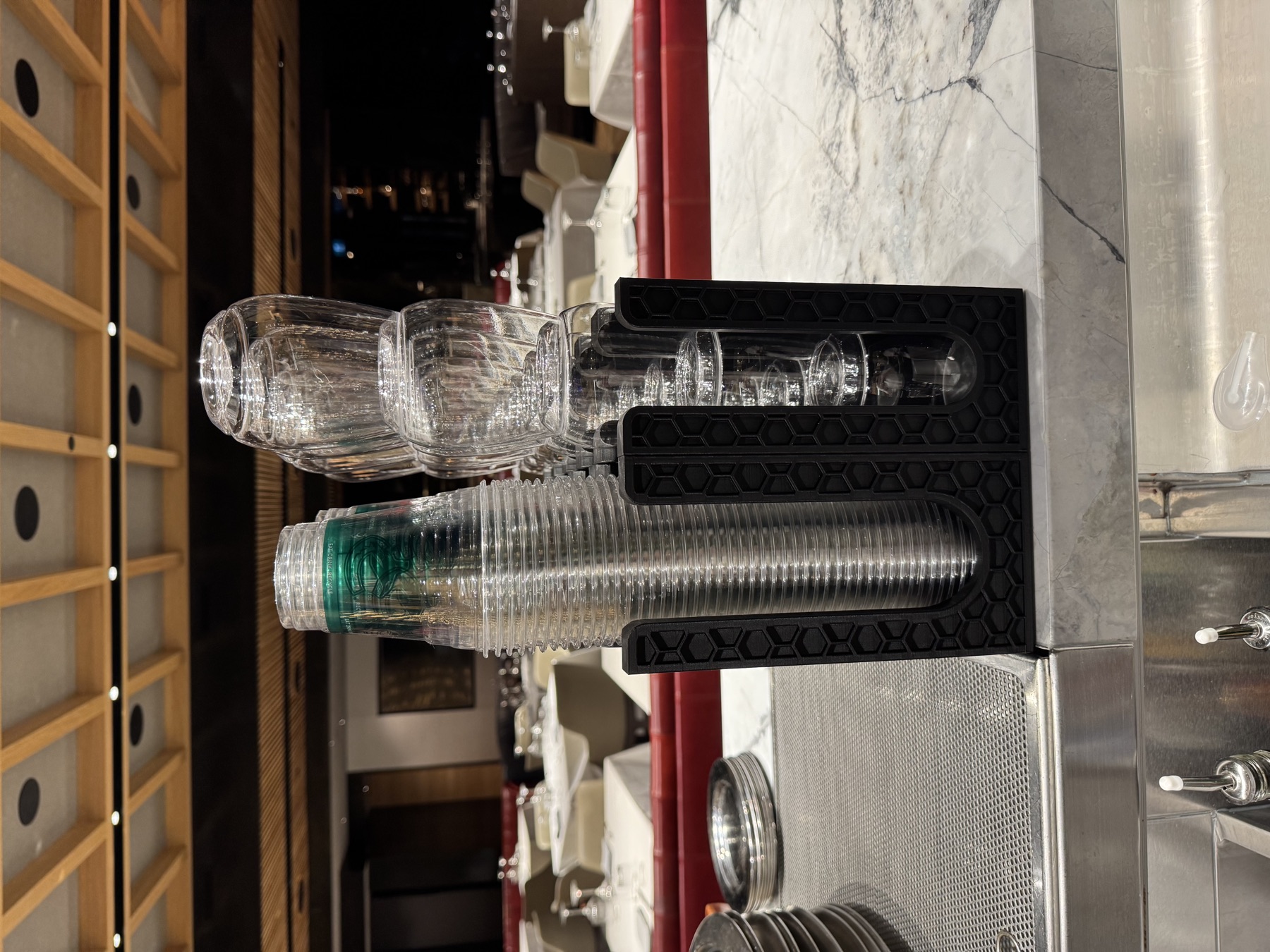 Custom black honeycomb organizers installed at a bar