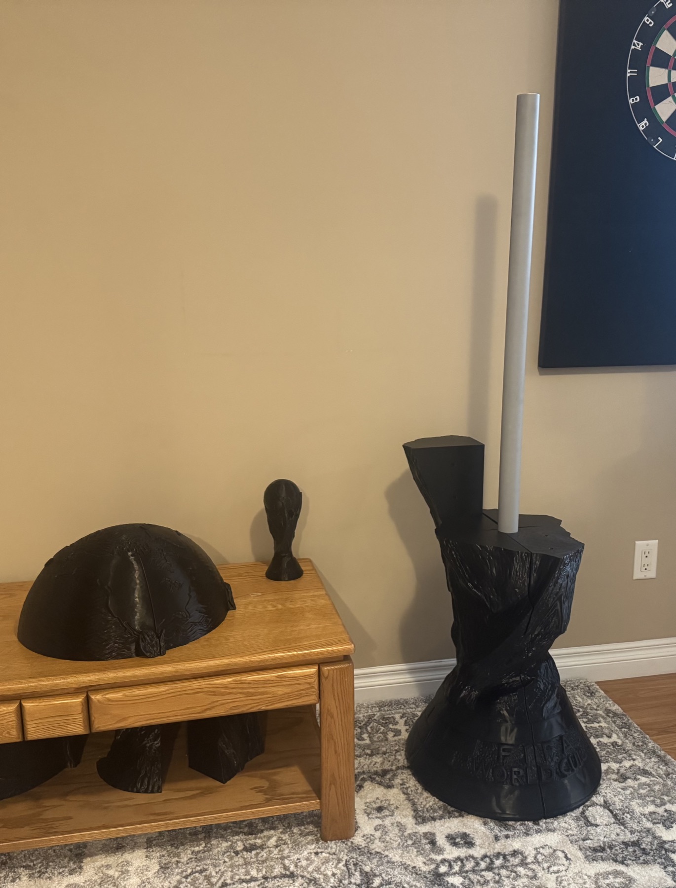 Black assembled trophy replica sections during fabrication